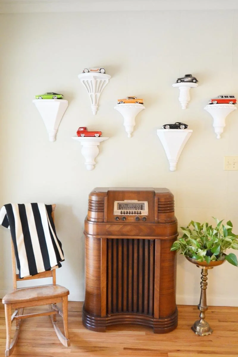 Model cars displayed on the wall with a variety of bracket styles in Highlands Ranch