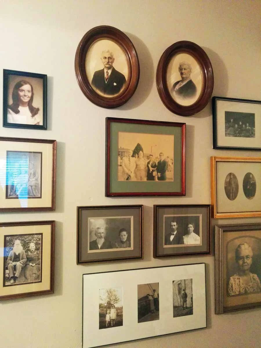 Heirloom family photos arranged in an interesting way in a historic Littleton CO home.