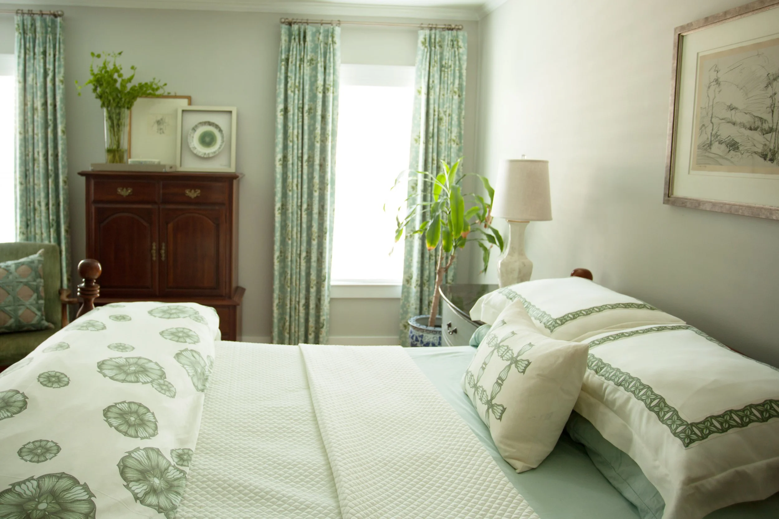 Jamie House Designed custom window treatments and bedding to pull together a client's own existing furnishings in the bedroom.