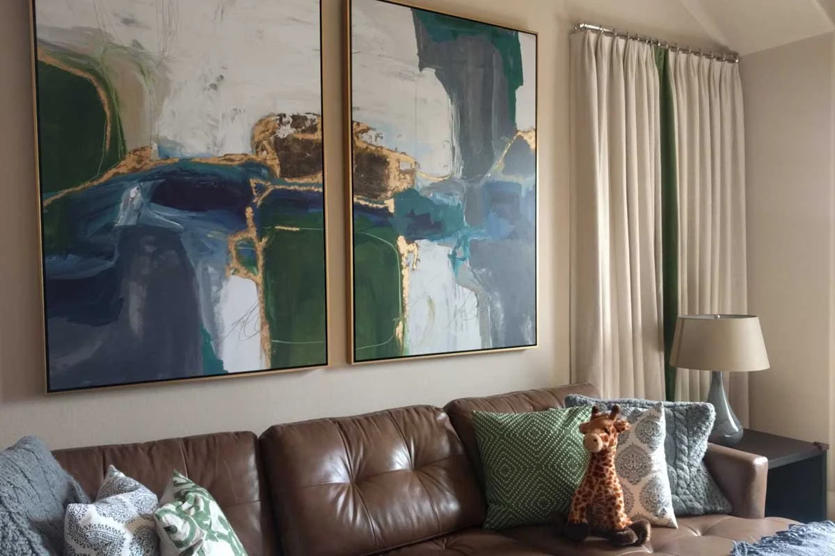Commissioned diptych hung over a leather sectional in a Highlands Ranch family room.