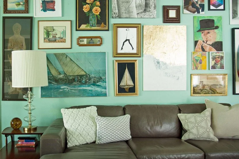 Original artwork collection displayed in Castle Pines Colorado home basement interior