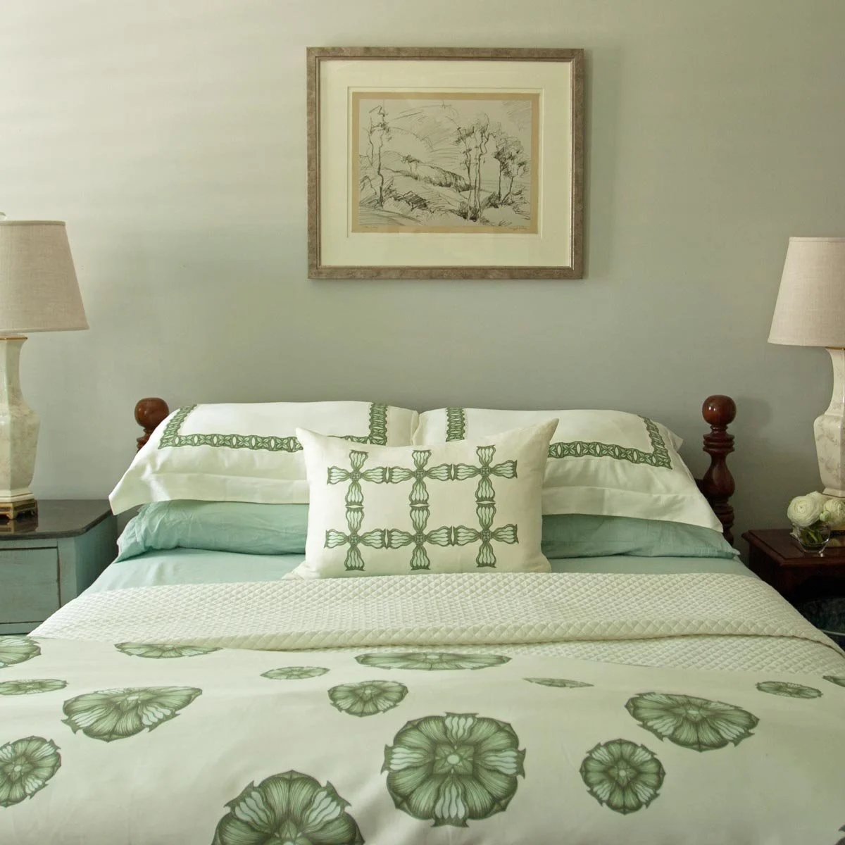 Bedroom design in Littleton CO featuring original art and antiques.
