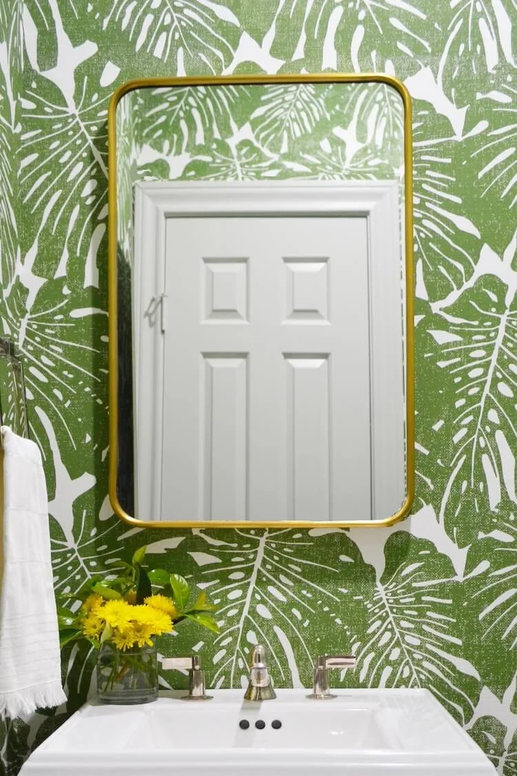 Bold wallpaper in a Centennial bathroom remodel by Jamie House Design