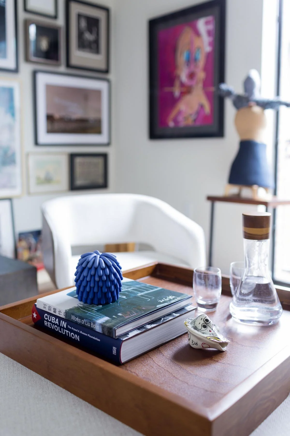 A collection of small art displayed on a tray in a Denver living room