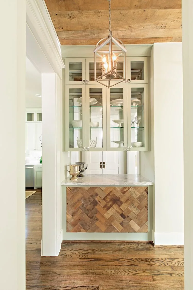 Butler's pantry with pass through in Historic home designed by Jamie House Design