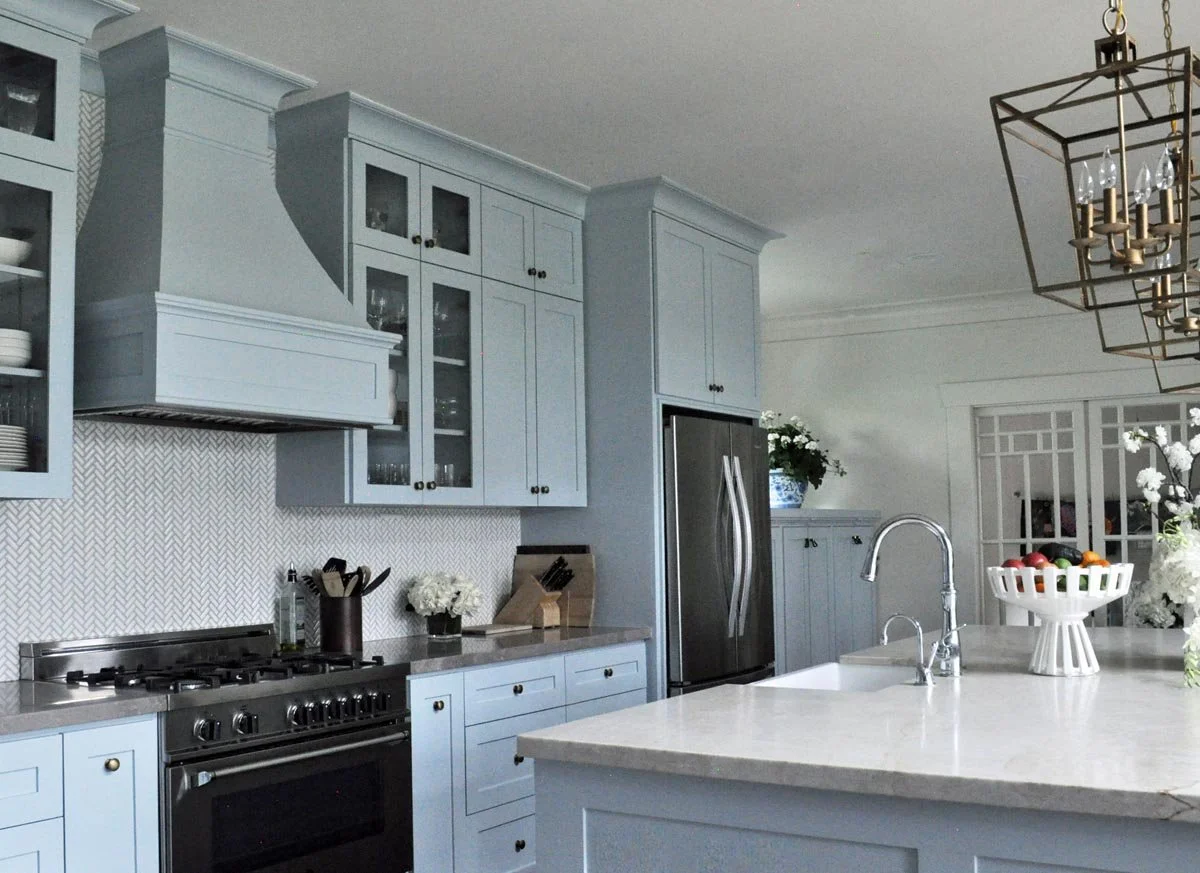 Custom cabinetry and kitchen design in soft farmhouse blue for a historic Denver bungalow