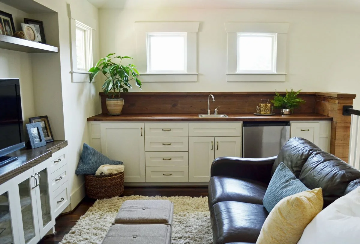 Kitchenette in basement TV room with walnut counter and shiplap backsplash in Denver historic remodel