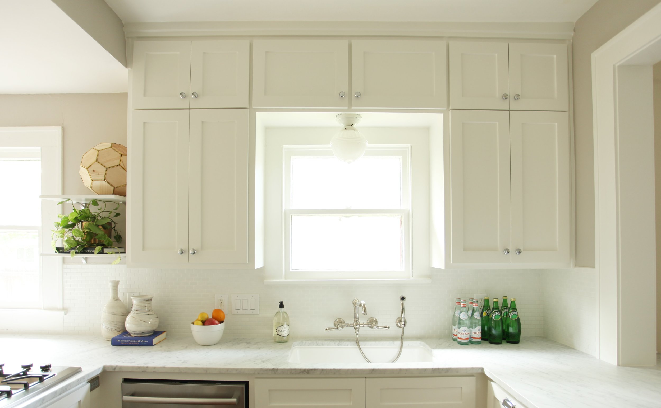 Craftsman bungalow kitchen remodel in Littleton CO featuring white and vintage accents.