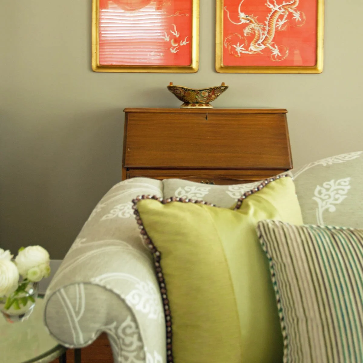 Living room interior design in a Littleton bungalow incorporating the client's antiques and reupholstering furniture.