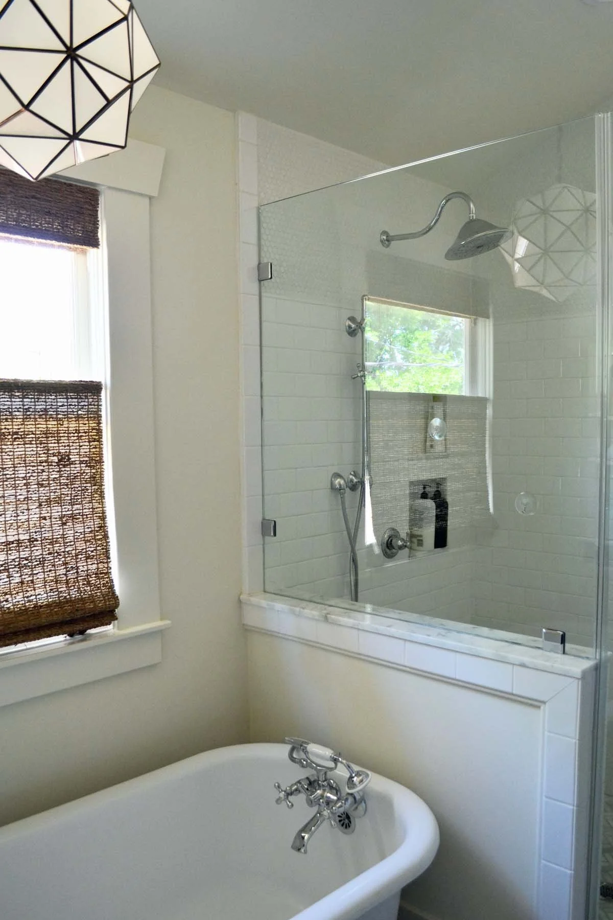 Historic Denver primary bathroom renovation with clawfoot bathtub and double shower