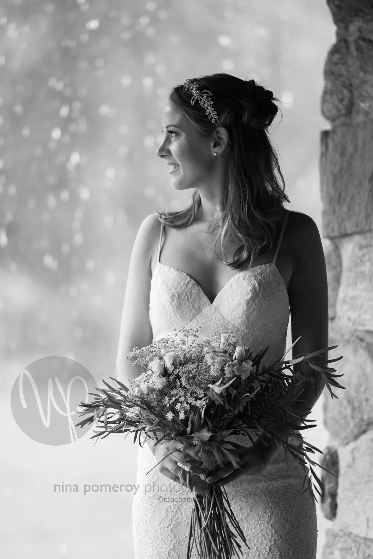 black and white portrait of the Bride waiting for the rain to pass before their vineyard wedding taken by bay area photographer nina pomeroy