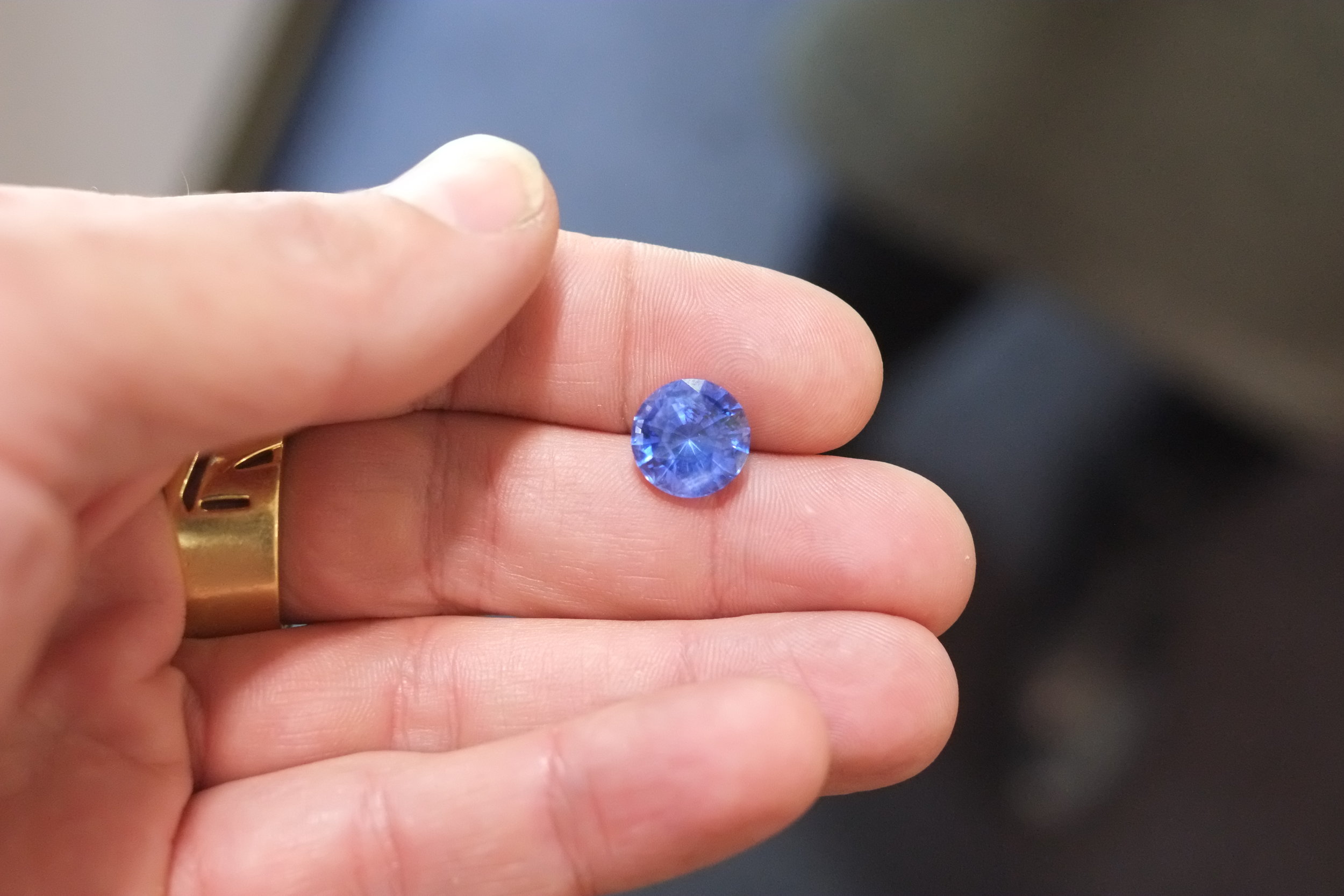 Rounds are Quite Rare in Large Sizes. This Color Change Sapphire Almost Glowed!