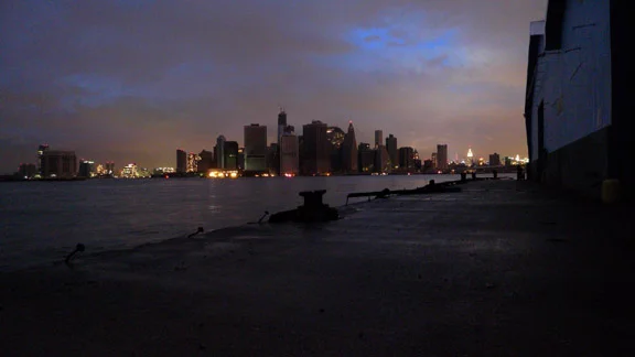 Lower Manhattan without power except at
Staten Island Ferry Terminal. Jersey to the left, midtown to the right.
Upsticking bolts show where head logs were ripped off the pier by Sandy.