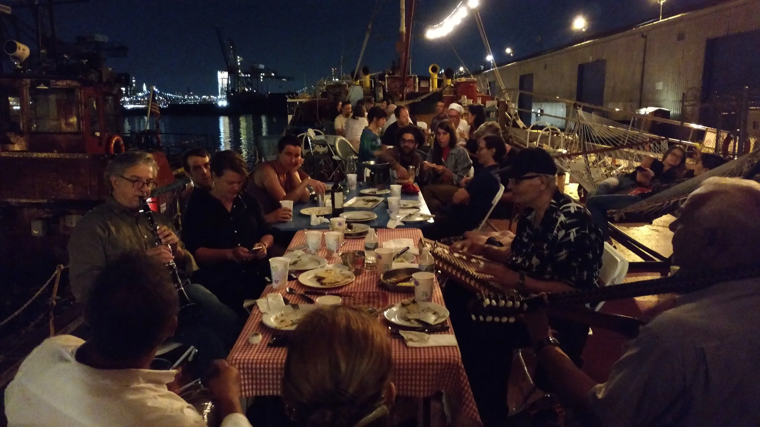 Musicians from overseas and around the USA in town for the night share their music after a meal. PortSide Second Sunday TankerTime, August 2017.