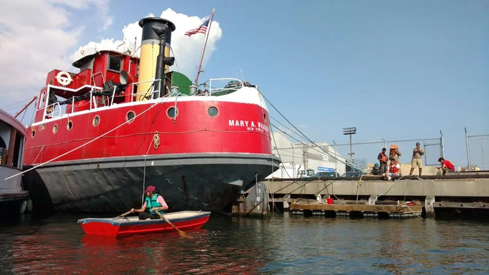 Interns use our new floating dock to get their first experience rowing and in a kayak