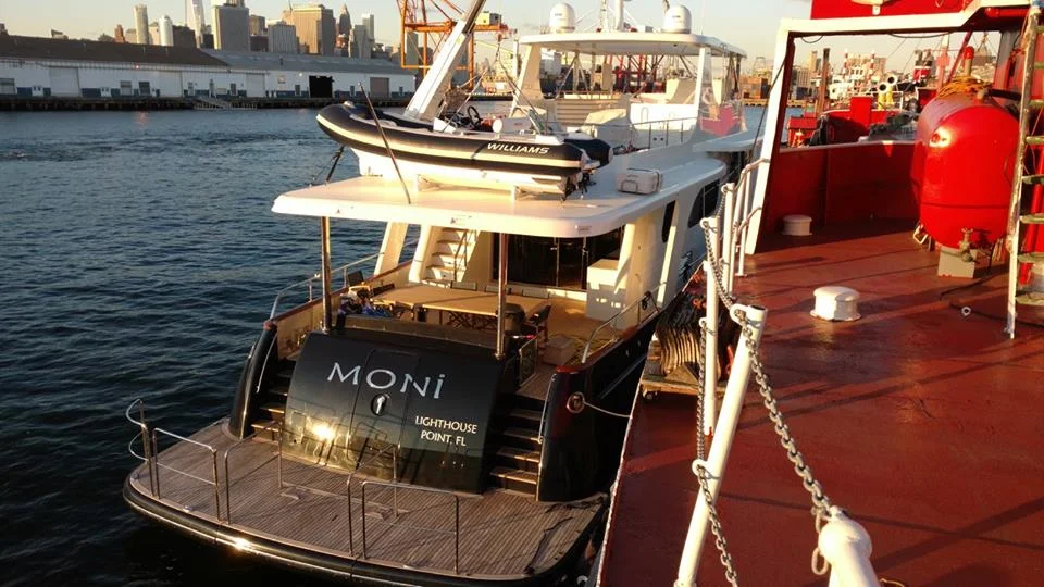 luxury yacht alongside the mary a. whalen.