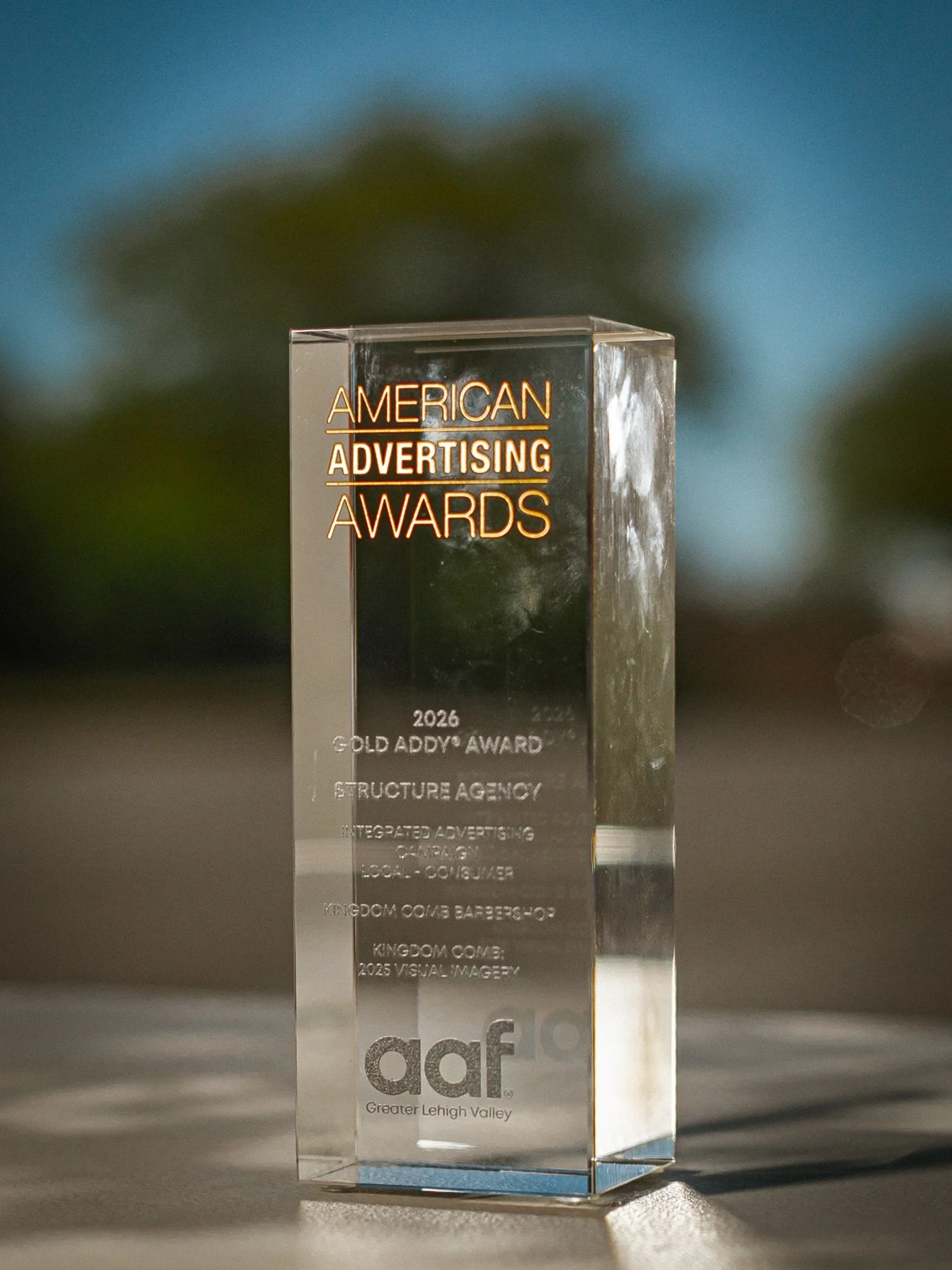 Structure Agency has been awarded Gold Addy for the @kingdom.comb integrated advertising campaign and 2025 imagery.

A barbershop is never just a barbershop. For Kingdom Comb, the work was about capturing the culture behind the chair. The craft. The 