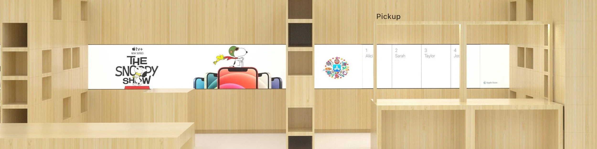 Store display with wooden shelving showcasing various Apple products and a poster for The Snoopy Show.