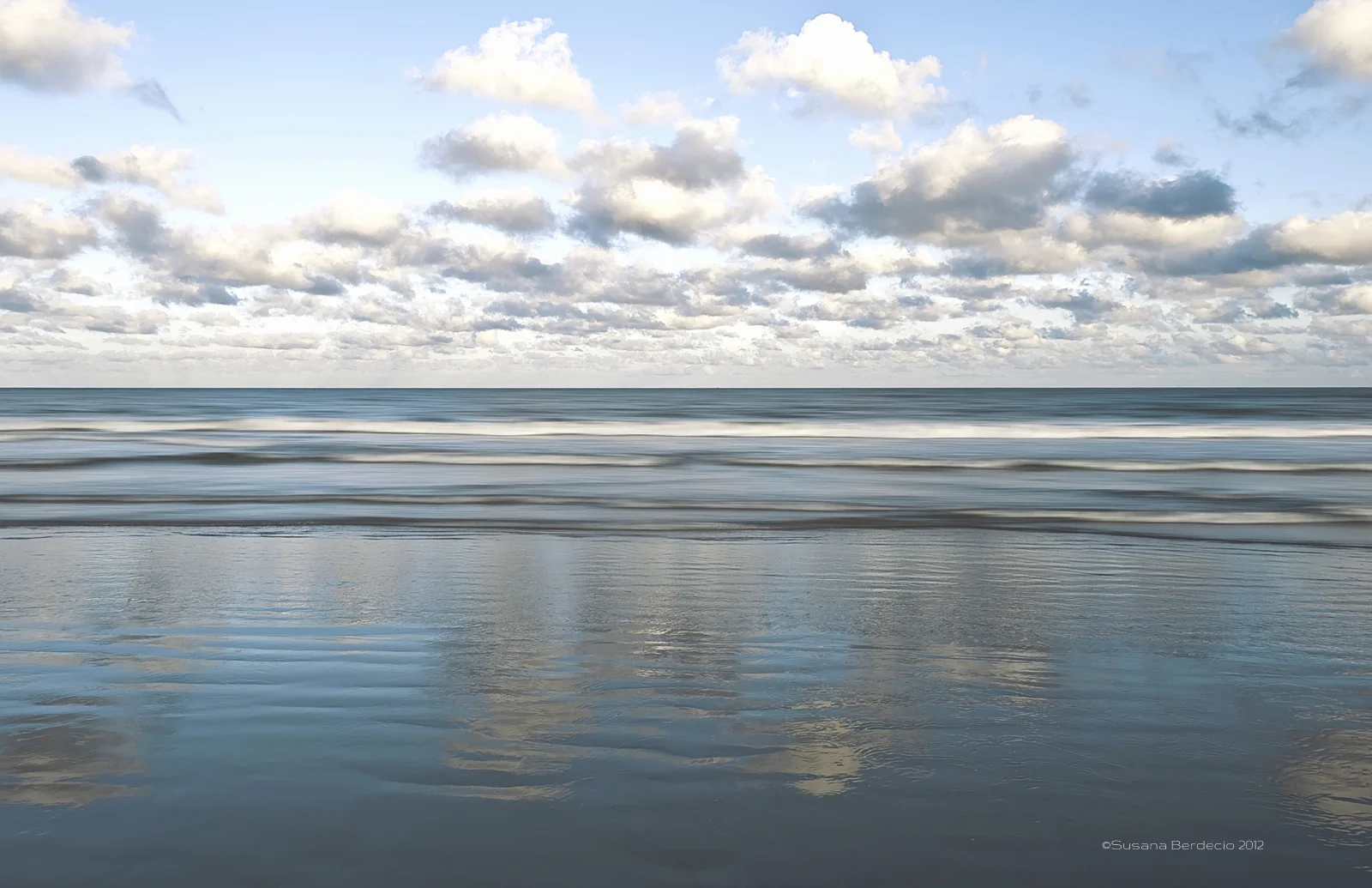 clouds, water, wet sand