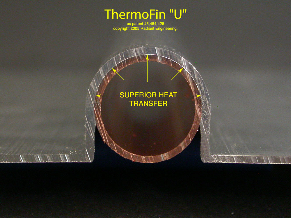 Sample #4 Close photo of ThermoFin U showing tight snap fit. Note that the copper tube has retained it's round shape after being snapped in the extrusion. The ThermoFin U sample tested is 4" wide, .050" thick and extruded from 6063 T5 aluminum alloy.