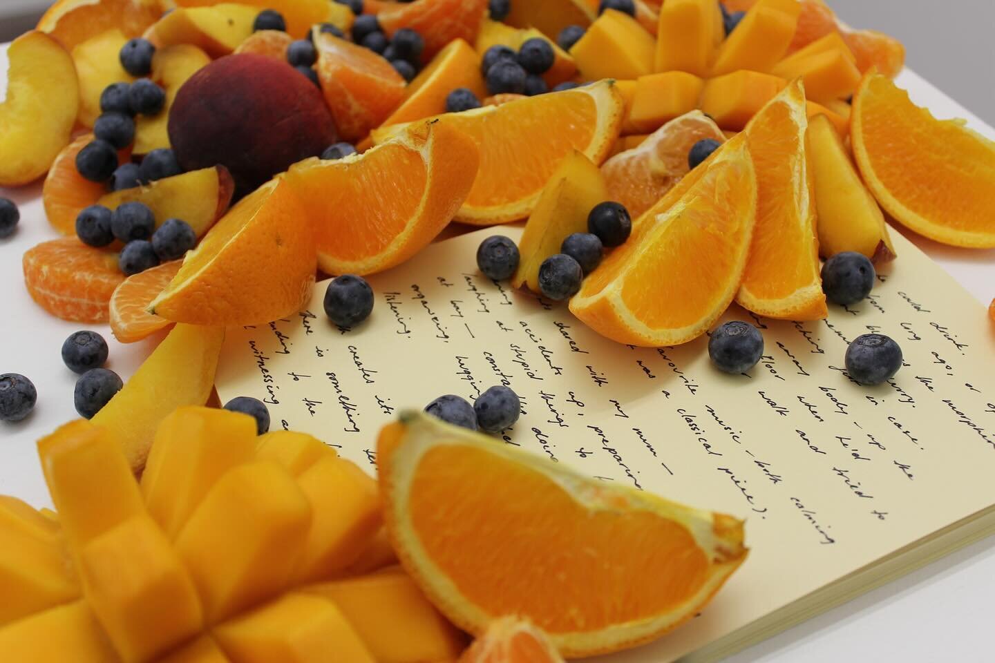 &lsquo;Actions for Sensory Disruption&rsquo; 2015, 
installation detail @busprojects 
Strategies for sharing food and increasing closeness, mango, orange, mandarin, peach, passion fruit, blueberries, artist book (sections 3 and 5).

Between late 2014