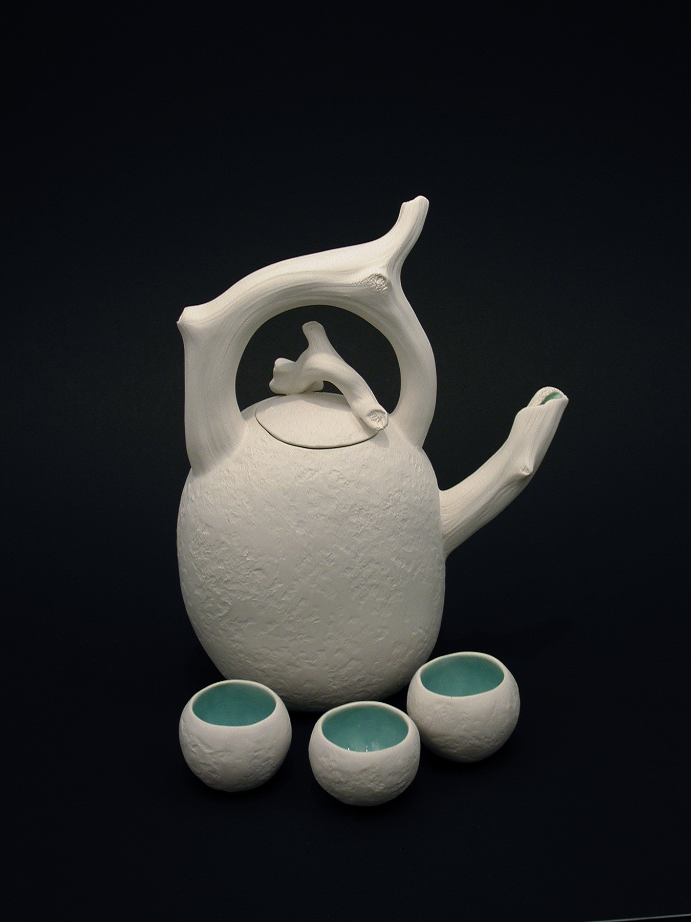 Teapot with three sip cups.jpg