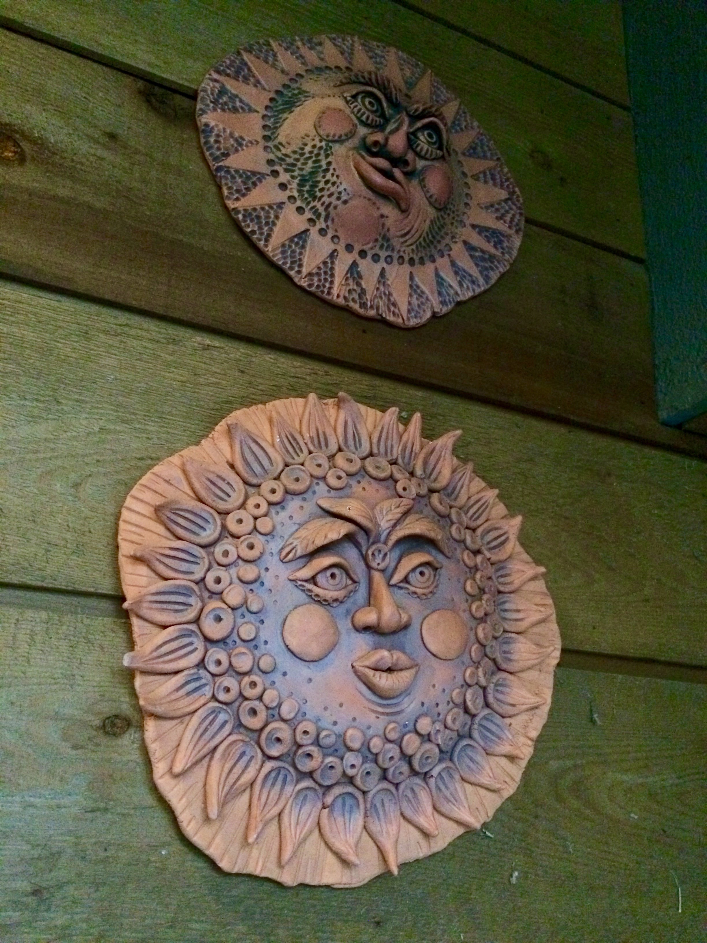 On the subject of hiding... I took this sun face down outside my studio door recently to take to school. I wanted to use it as an example for the students since they are starting this project in clay. After removing it, I was startled to discover something on the wall that had been hidden by the sun face!