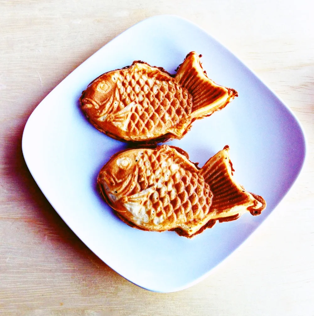 Taiyaki. A Japanese waffle shaped like a fish. This one is stuffed with Nutella! 