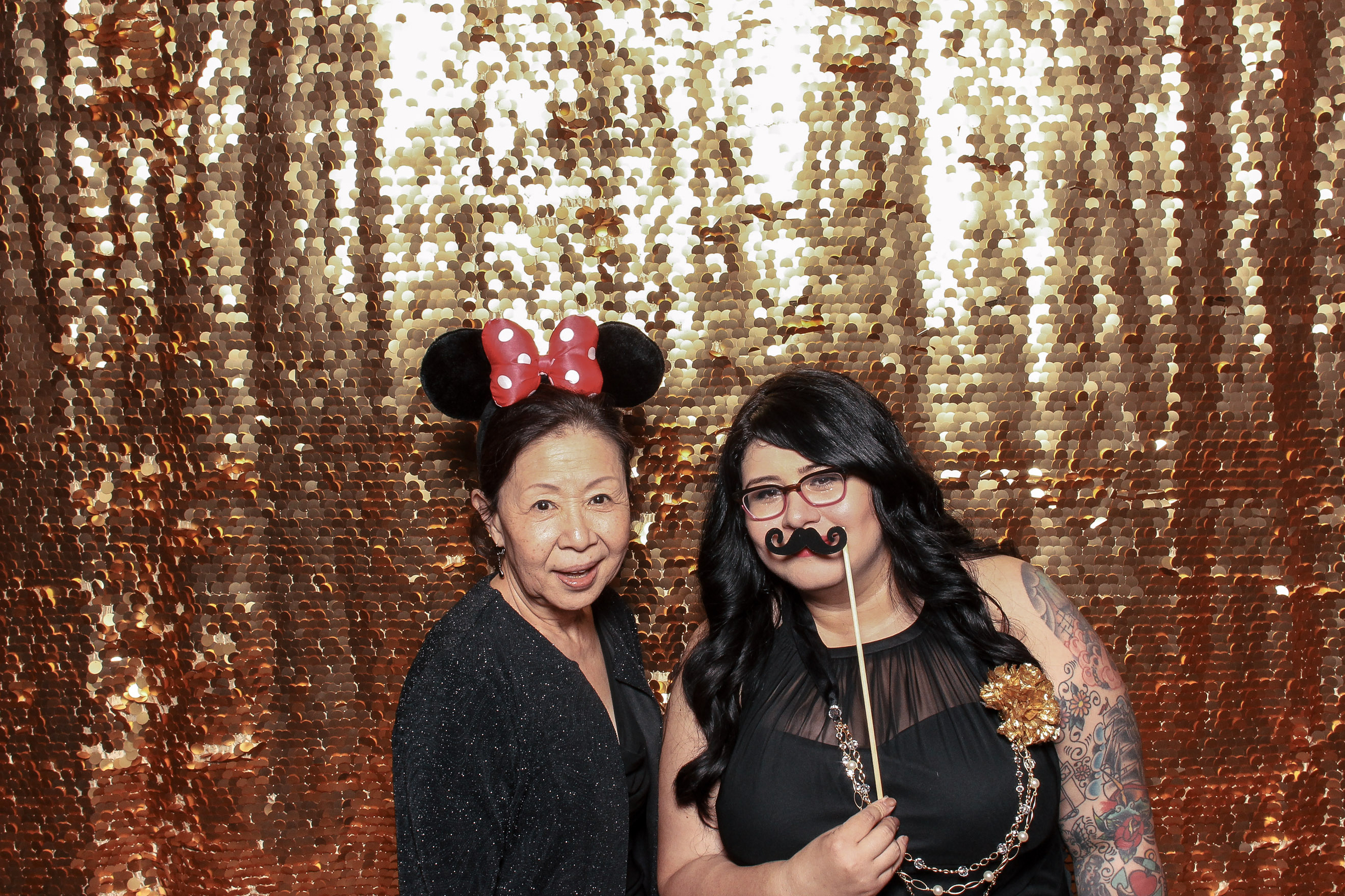 My friends had a Photo Booth and I loved how fun it was. We were awkward, funny, and you really get to know someone when they pick up a prop. This is my friend's aunt, how adorable and cool is she in those Minnie ears??