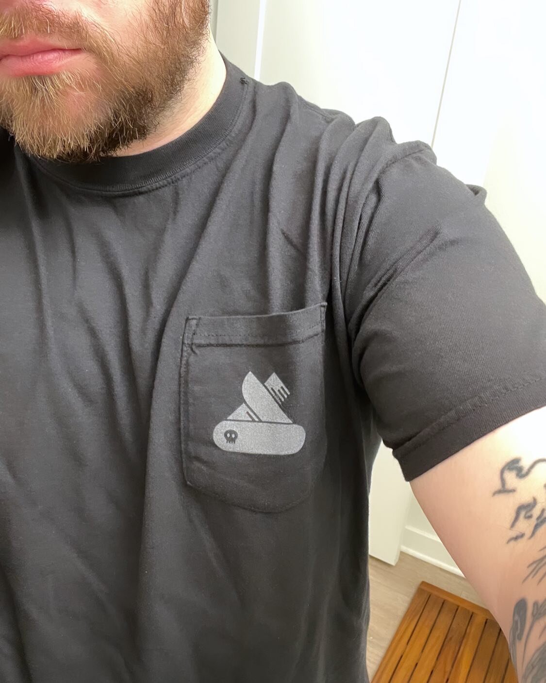 Pocket T + logo is making me feel things. I could have gone a few shades darker with the print though. I think I&rsquo;m going to try some kind of shiny black material on black shirts next. #graphicdesigner #printer #remember