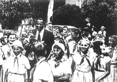 Paul Robeson with children of the Soviet Union at a summer camp on the Black Sea.