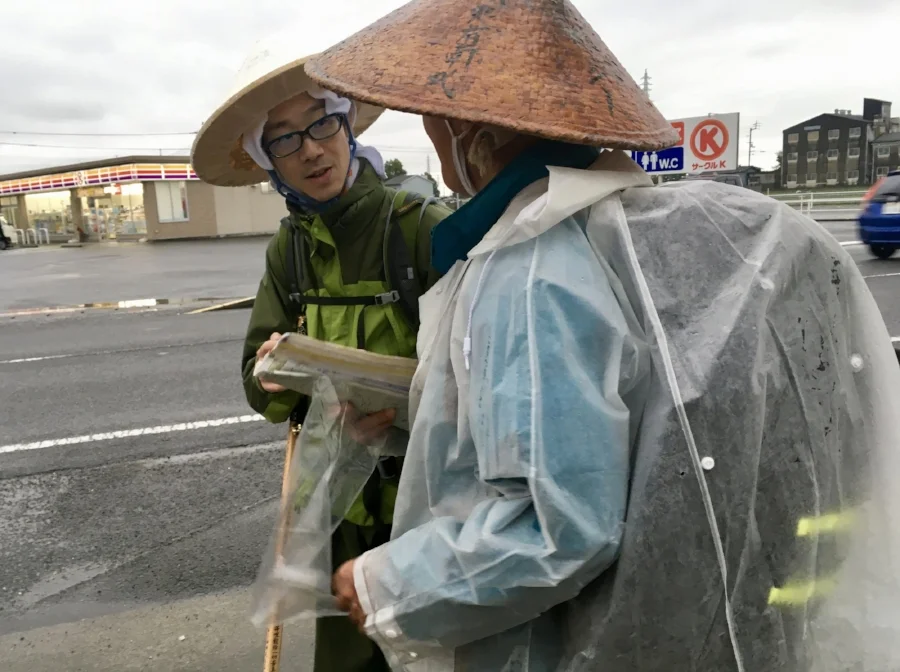 My two companions for the day, debating about the next location. Not pictured: Me, happy to get a much-needed break from walking all day in the rain