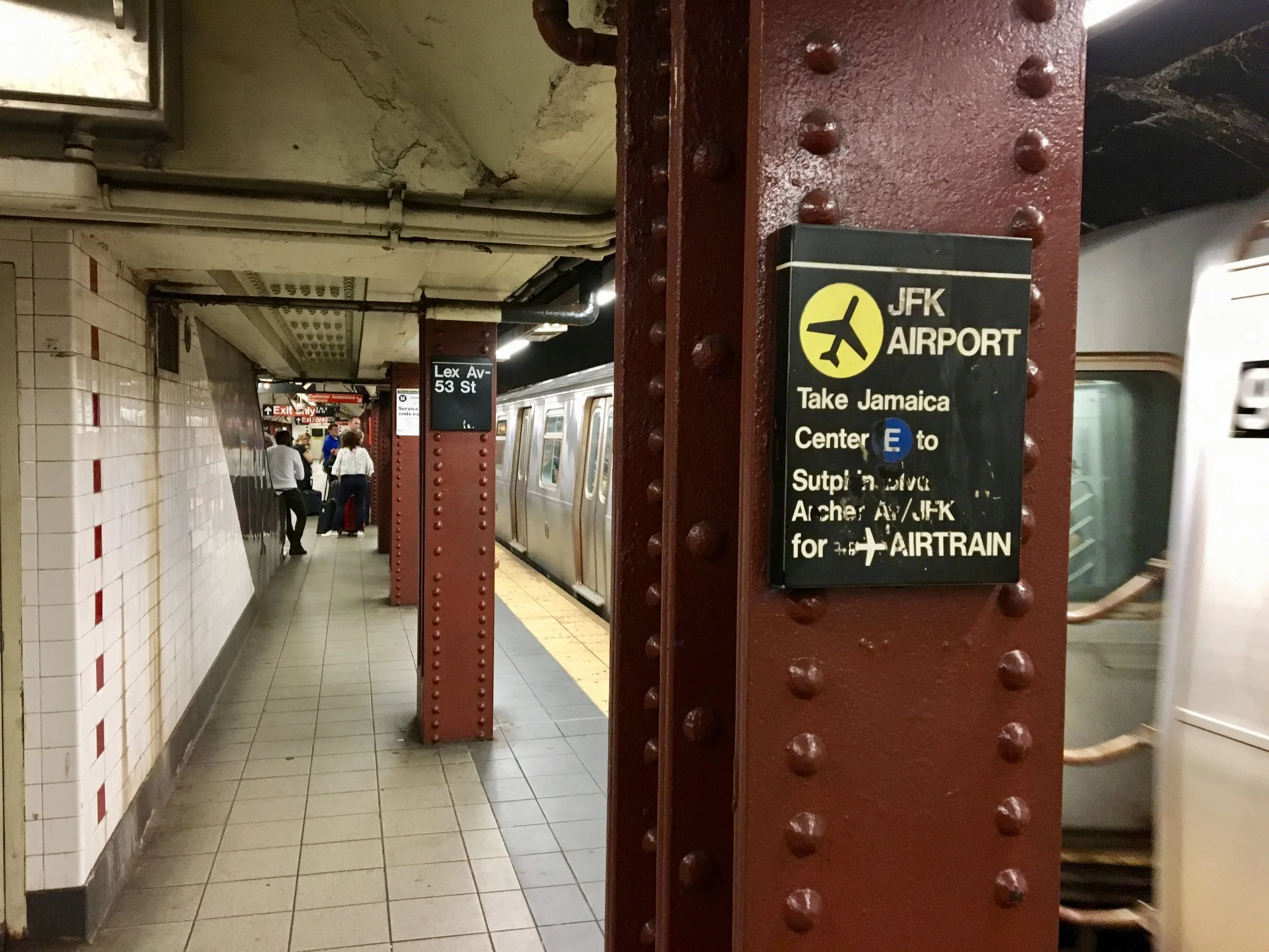 New York City's attempt to care that tourists and visitors easily find their way to JFK.