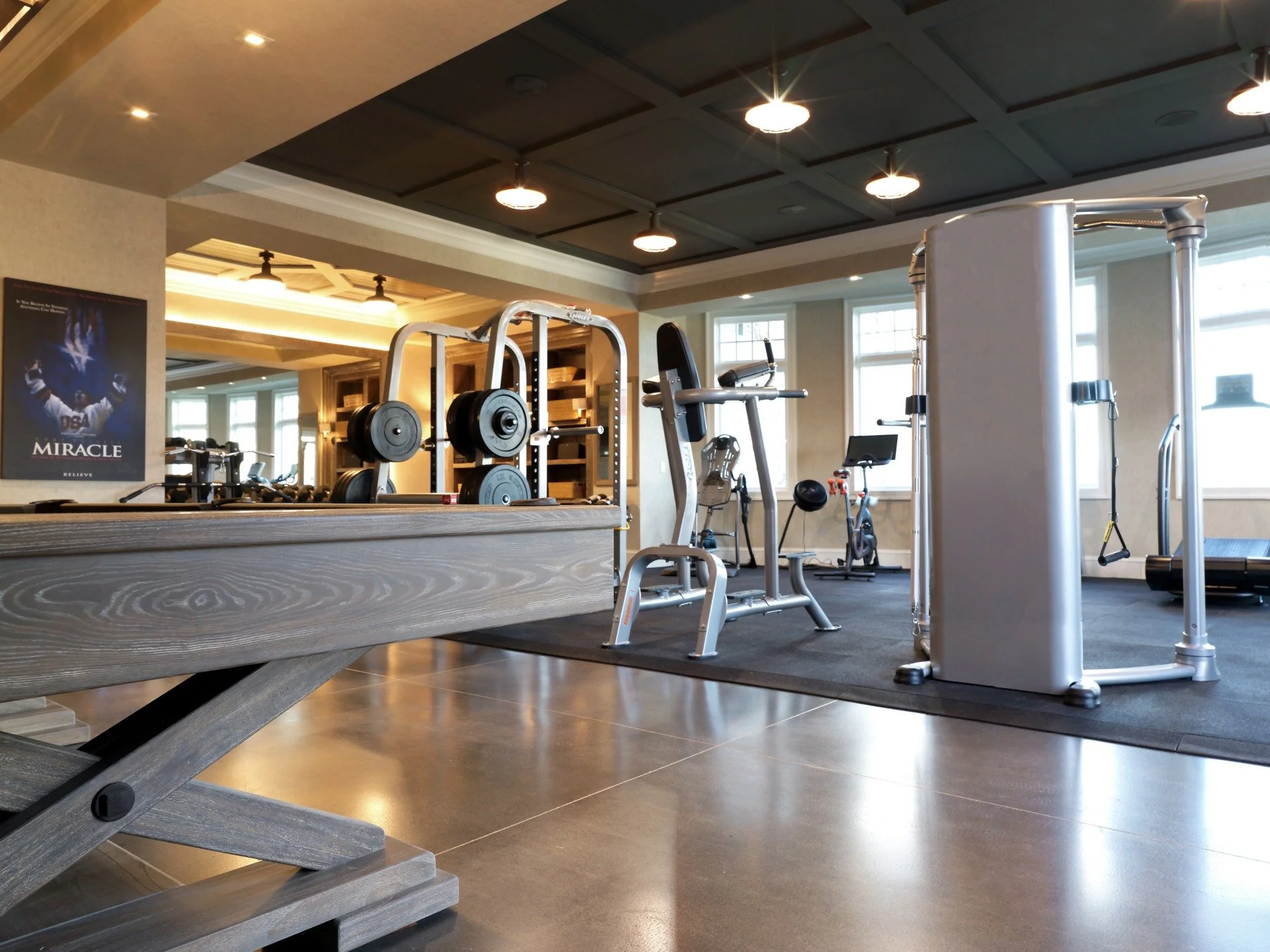 Some days it&rsquo;s pool, some days it&rsquo;s pull-ups. 😉 When your gym feels like part of your home&mdash;and not just a room with equipment&mdash;you actually want to be in it. ✨

Here, polished concrete carries through the space, while a layer 