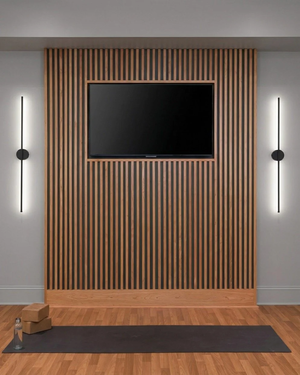 Don&rsquo;t forget the lighting. ✨

A rich, moody wood slat wall can absolutely anchor a home gym or yoga studio &mdash; but if you really want to elevate the space, the magic is always in the details. Lighting is one of those details people overlook