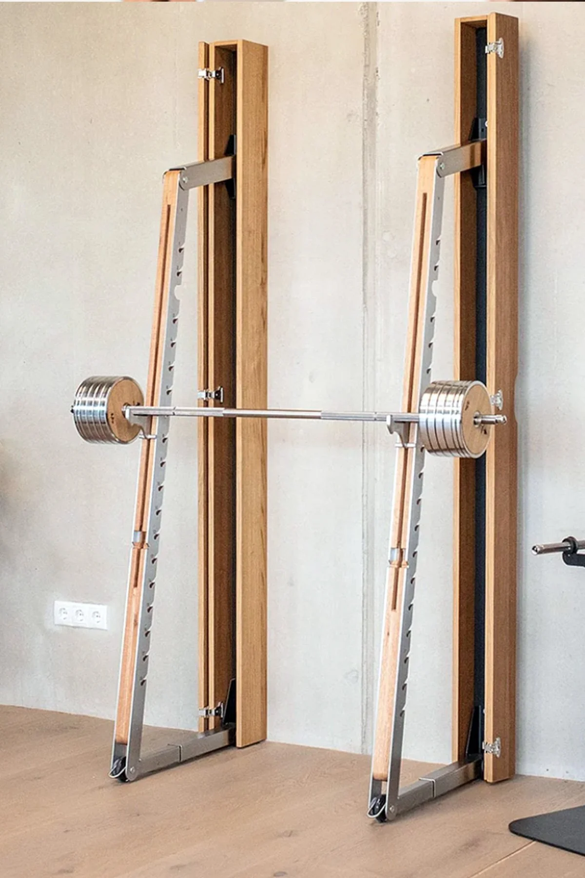 nohrd squat rack with barbell and weight plates