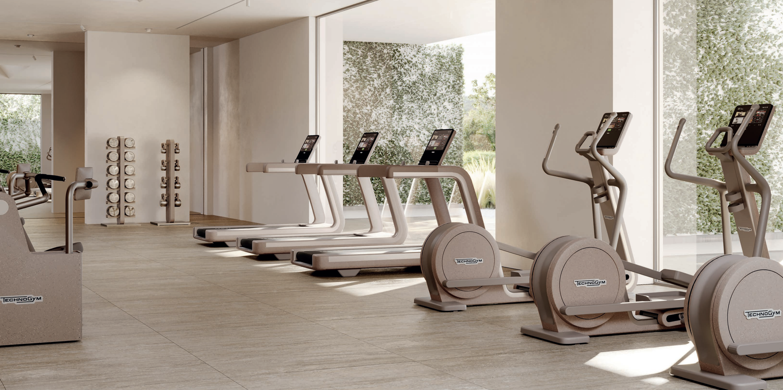 hotel gym filled with technogym sandstone collection.png