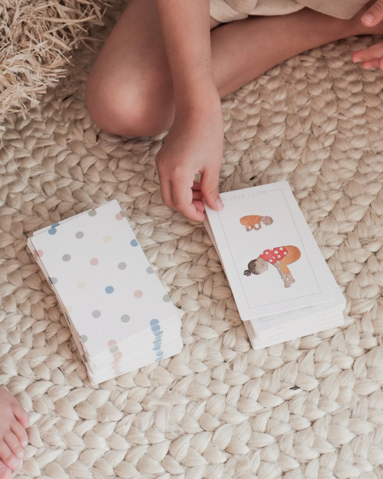 Girls hand playing Premiere Childs Game - Yoga Snap Cards.jpg
