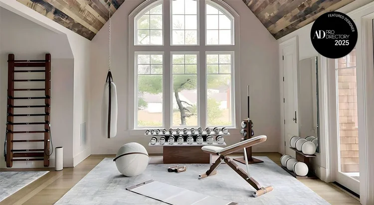 Luxury home gym interior design by Iron House with PENT handcrafted fitness equipment, featuring modern wood and steel accents.