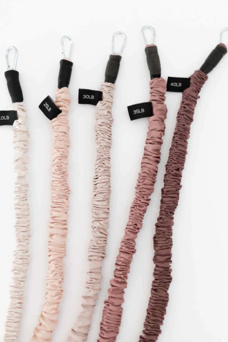 Close-up of neutral resistance bands showing five weight levels: 20lb, 25lb, 30lb, 35lb, and 40lb.