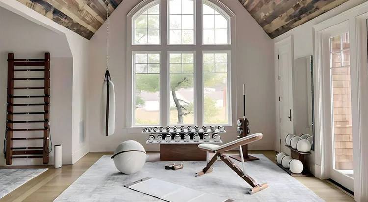 luxury home gym design by Iron House featuring PENT fitness equipment