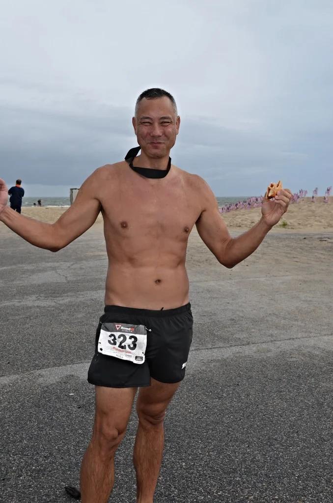 Mud-free and eating his 6th slice of free pizza.
