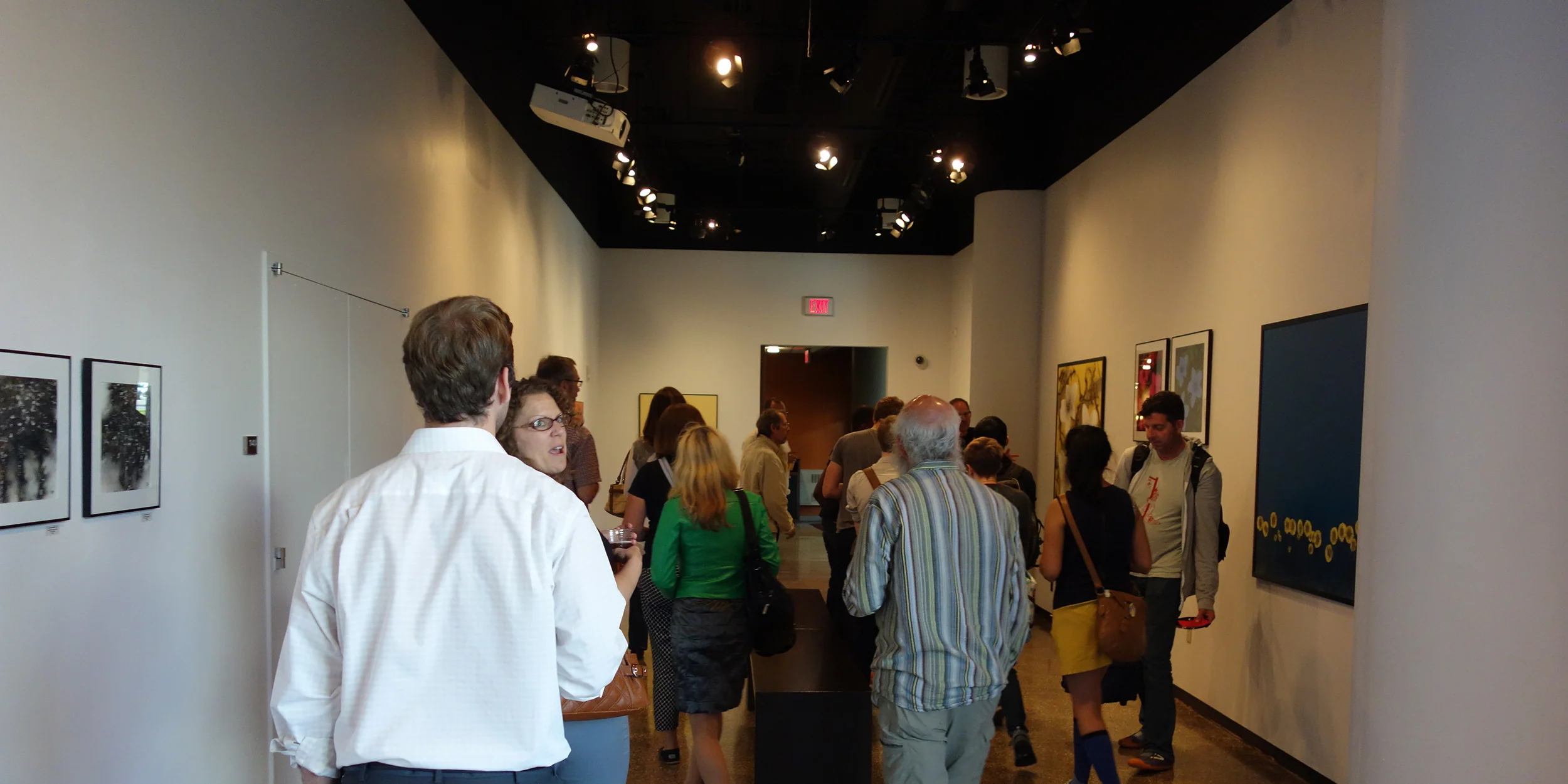 A good group of family, friends, and fans check out the explosion art.