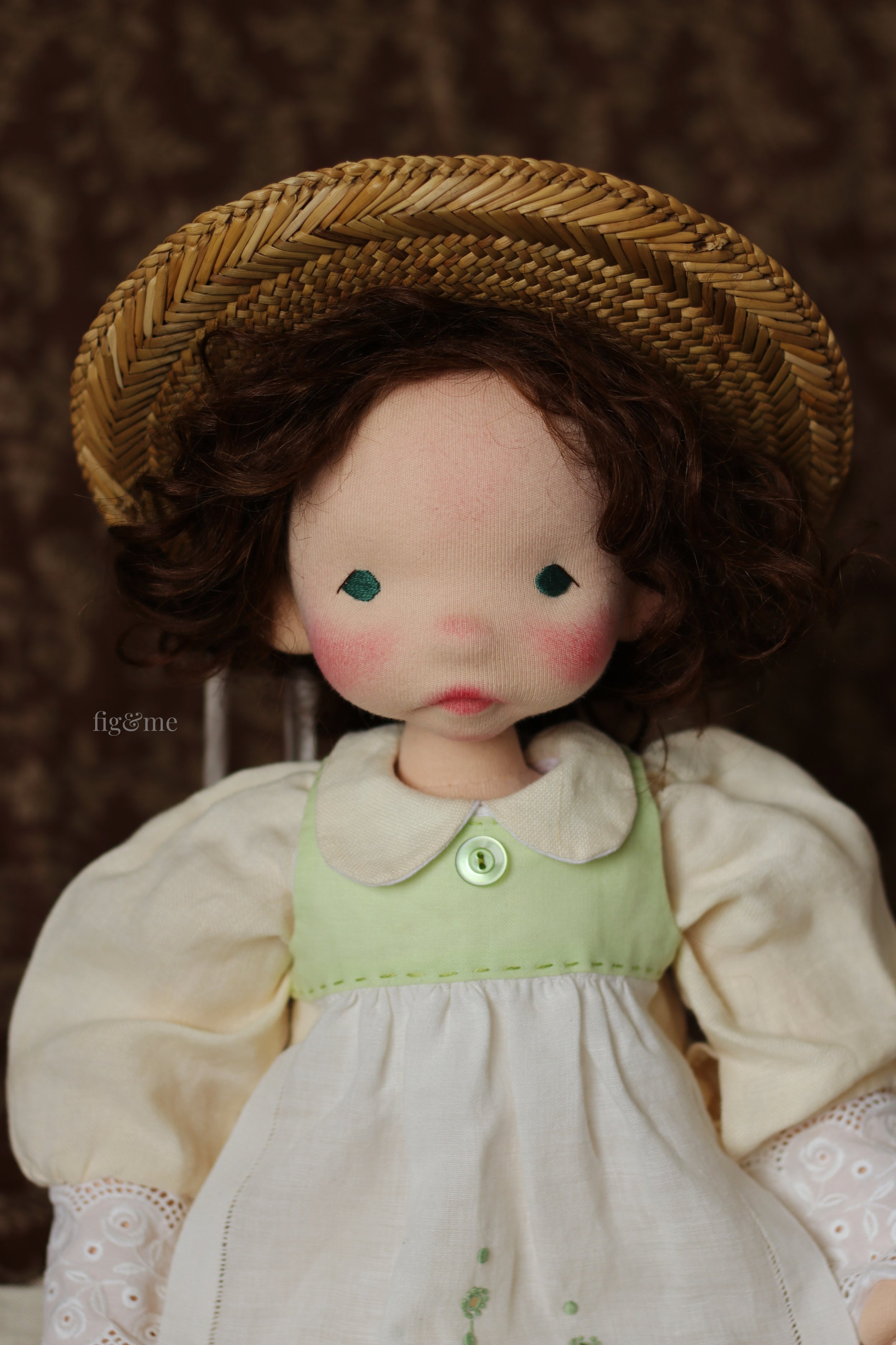 Art doll Sara Crewe sculpted in wool and wearing all linen old fashioned clothing.