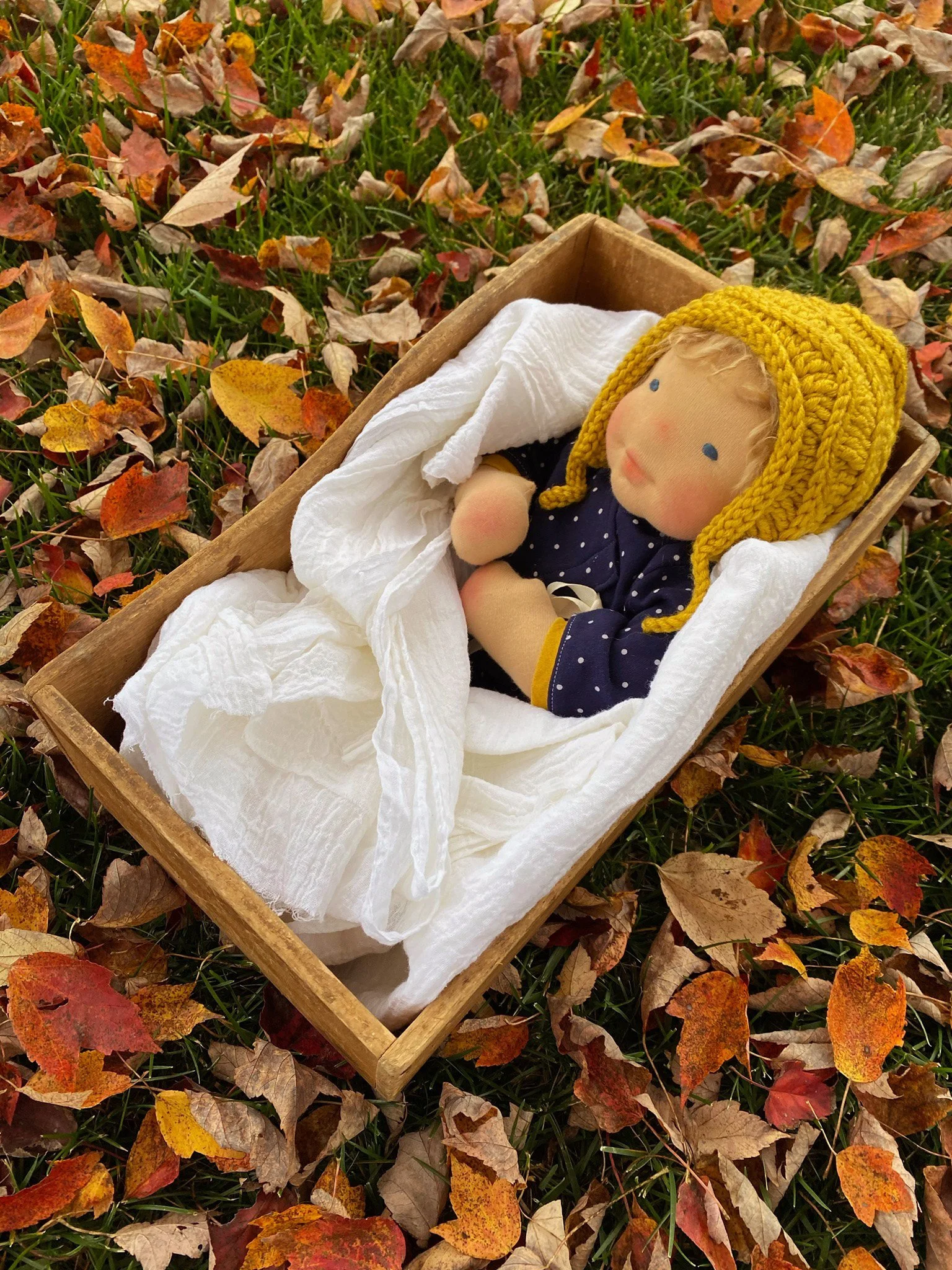 Waldorf inspired baby doll in an autumn setting, made during fig and me baby online class
