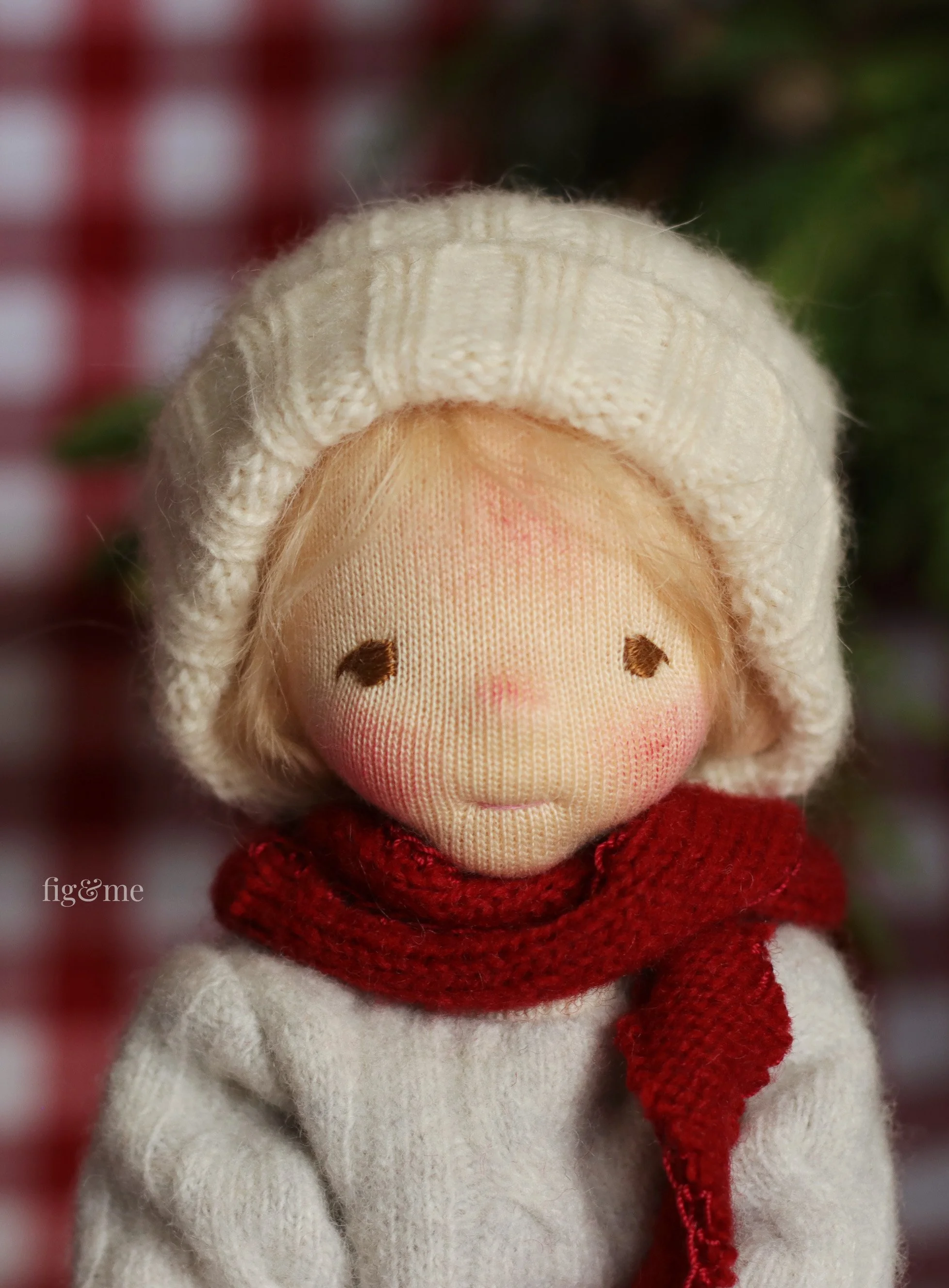 boy art doll with red scarf