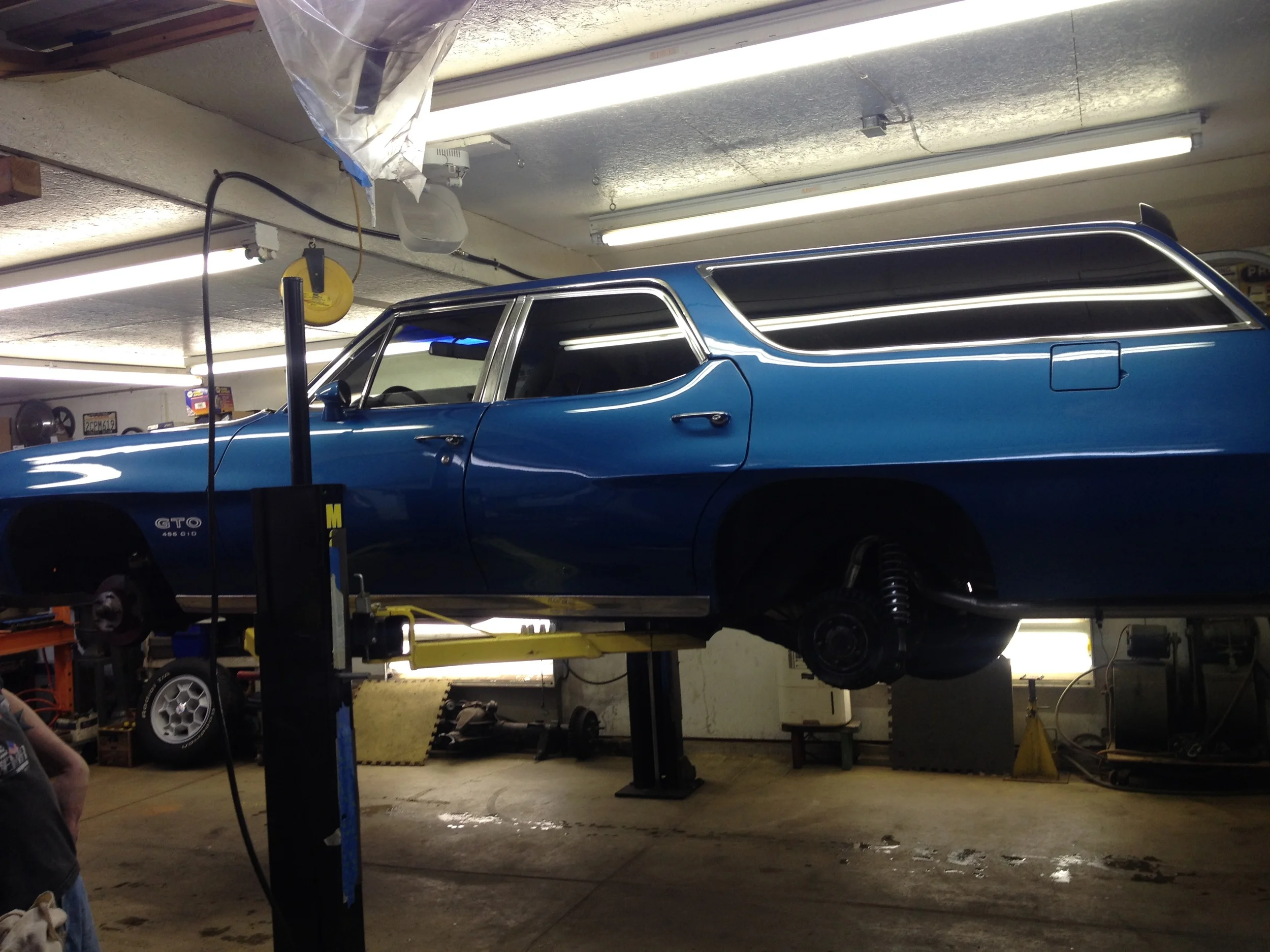 ON the hoist, wheels off, ready for work.