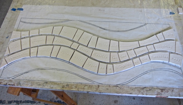 Out of the kiln, ceramic tiles are ready to be glazed.