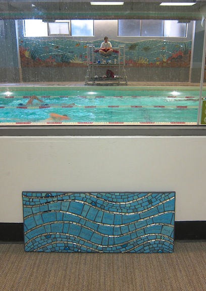 The piece will be hung here, overlooking the pool mural