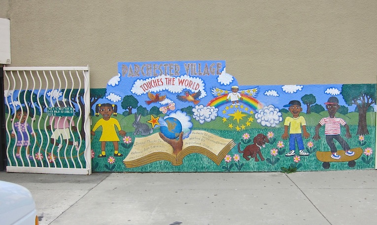 Existing mural on the front of the community center. Artist unknown